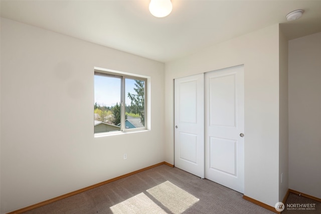 382 NE Ohenry Ct, Poulsbo, WA 98370 - unfurnished bedroom with light carpet, baseboards, and a closet