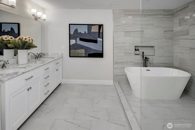8001 Talbot Rd, Edmonds, WA 98026 - bathroom with marble look tile flooring, a freestanding tub, and double vanity