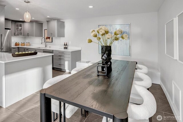 8001 Talbot Rd, Edmonds, WA 98026 - tiled dining space with a sink and recessed lighting