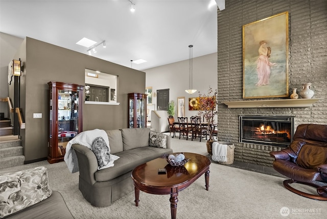 7340 Steilacoom Blvd SW, Lakewood, WA 98499 - living area with track lighting, stairs, carpet floors, and a brick fireplace