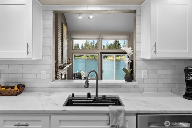 7340 Steilacoom Blvd SW, Lakewood, WA 98499 - kitchen featuring decorative backsplash, stainless steel dishwasher, white cabinets, and a sink