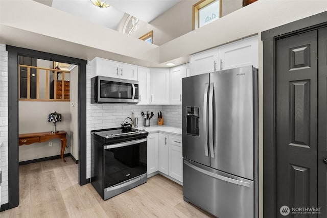 7340 Steilacoom Blvd SW, Lakewood, WA 98499 - kitchen with decorative backsplash, white cabinetry, stainless steel appliances, and light wood-type flooring