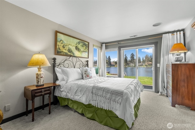 7340 Steilacoom Blvd SW, Lakewood, WA 98499 - bedroom featuring light colored carpet, visible vents, a water view, and access to outside