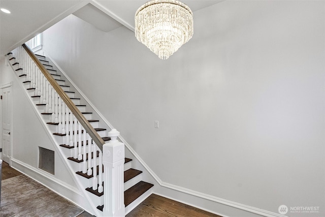 511 N E St, Tacoma, WA 98403 - staircase with an inviting chandelier, recessed lighting, baseboards, and wood finished floors