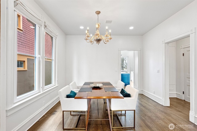 511 N E St, Tacoma, WA 98403 - dining space featuring recessed lighting, wood finished floors, baseboards, and a notable chandelier