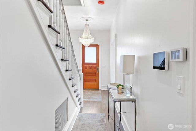 511 N E St, Tacoma, WA 98403 - entrance foyer featuring stairway, visible vents, a chandelier, and light wood-type flooring