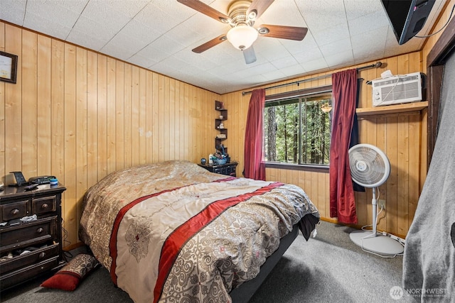 100 N Duckabush Dr W, Hoodsport, WA 98548 - bedroom with carpet, an AC wall unit, wooden walls, and a ceiling fan