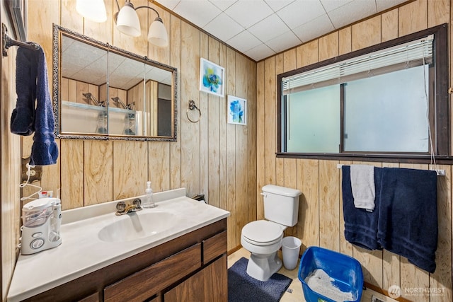 100 N Duckabush Dr W, Hoodsport, WA 98548 - bathroom with wood walls, toilet, and vanity