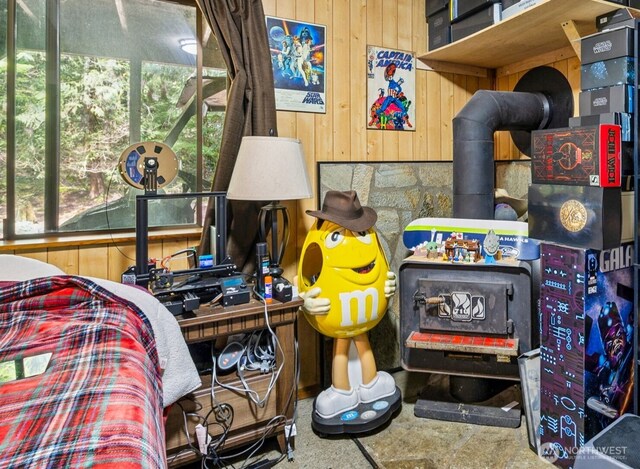 100 N Duckabush Dr W, Hoodsport, WA 98548 - bedroom with wood walls and a wood stove
