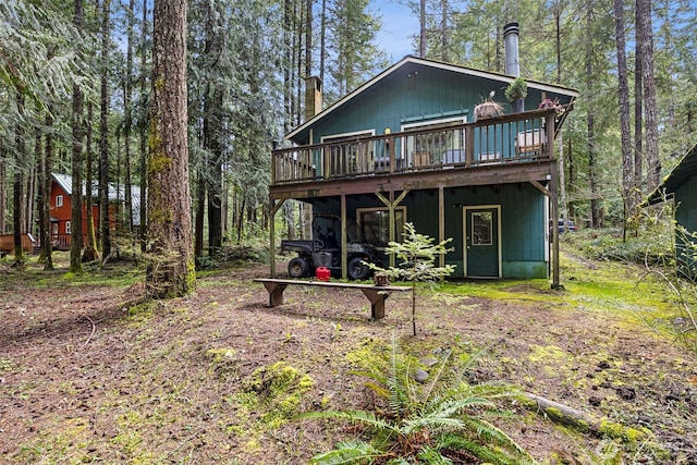 100 N Duckabush Dr W, Hoodsport, WA 98548 - rear view of property featuring a wooden deck and a chimney