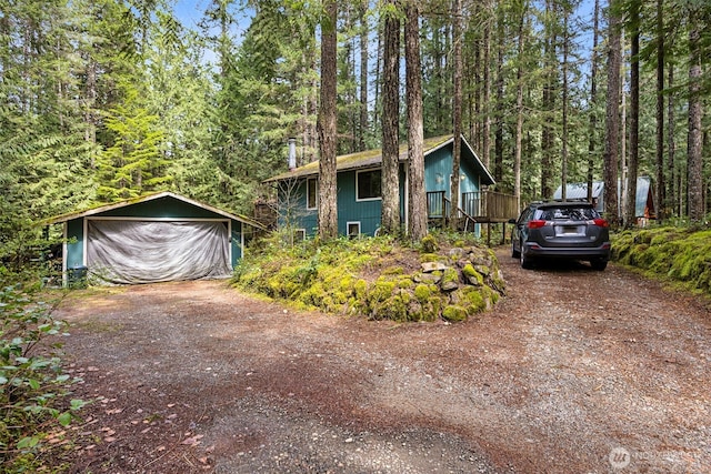 100 N Duckabush Dr W, Hoodsport, WA 98548 - view of front of property with an outbuilding, dirt driveway, and a wooded view
