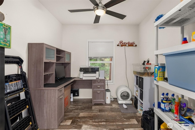 home office featuring dark wood-type flooring and a ceiling fan