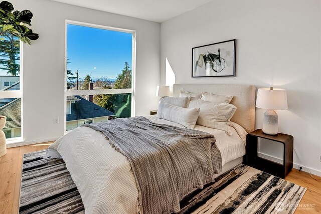 1233 E Roy St, Seattle, WA 98102 - bedroom with wood finished floors and baseboards