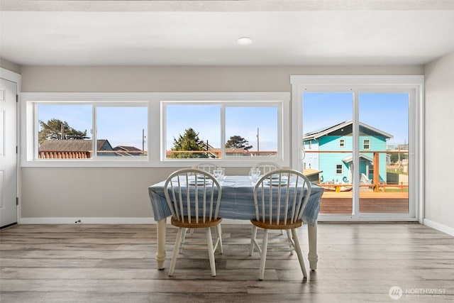 34 4th St S, Pacific Beach, WA 98571 - dining area with wood finished floors, baseboards, and plenty of natural light