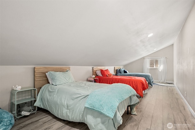 34 4th St S, Pacific Beach, WA 98571 - bedroom featuring baseboards, wood finished floors, and lofted ceiling