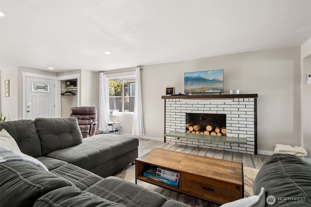 34 4th St S, Pacific Beach, WA 98571 - living room with recessed lighting, a brick fireplace, baseboards, and wood finished floors