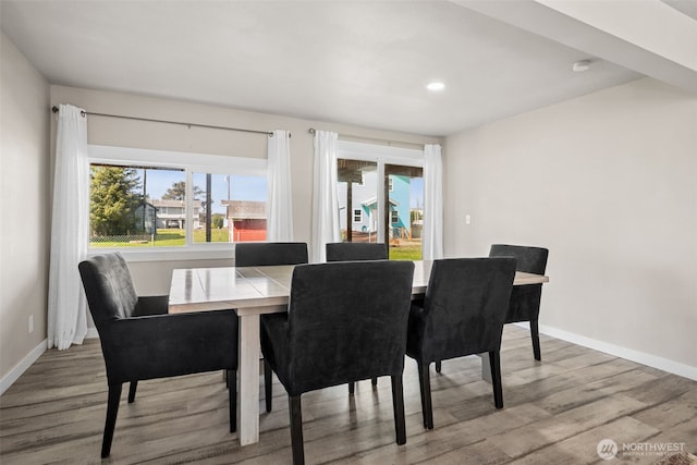 34 4th St S, Pacific Beach, WA 98571 - dining area featuring a wealth of natural light, baseboards, and wood finished floors