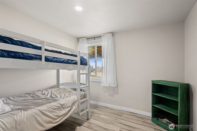 34 4th St S, Pacific Beach, WA 98571 - bedroom featuring baseboards, recessed lighting, and wood finished floors