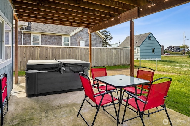 34 4th St S, Pacific Beach, WA 98571 - view of patio / terrace with outdoor dining area, a fenced backyard, and a hot tub
