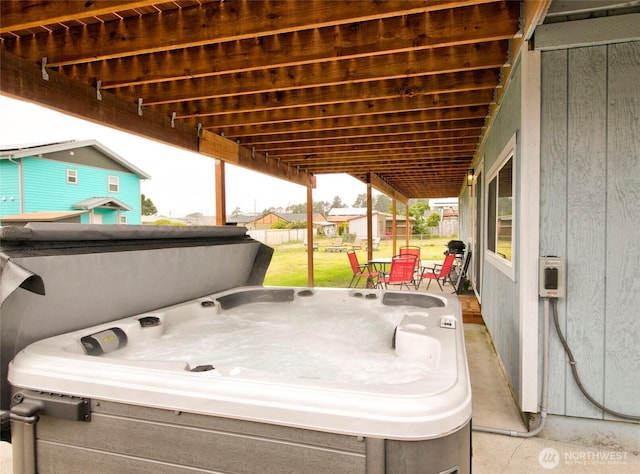 34 4th St S, Pacific Beach, WA 98571 - view of patio featuring fence and a hot tub