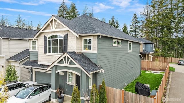 19815 152nd Street Ct E, Bonney Lake, WA 98391 - view of front of property featuring fence private yard, an attached garage, and roof with shingles
