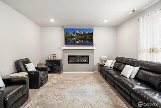 19815 152nd Street Ct E, Bonney Lake, WA 98391 - living area featuring light carpet, a glass covered fireplace, visible vents, and recessed lighting