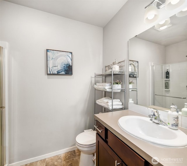 19815 152nd Street Ct E, Bonney Lake, WA 98391 - bathroom featuring baseboards, an enclosed shower, vanity, and toilet