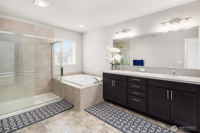 19815 152nd Street Ct E, Bonney Lake, WA 98391 - bathroom featuring a garden tub, a sink, a shower stall, and double vanity