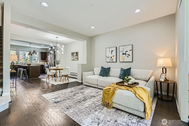 2546 NE Mulberry Walk, Issaquah, WA 98029 - living area featuring a baseboard heating unit, an inviting chandelier, and dark wood-type flooring