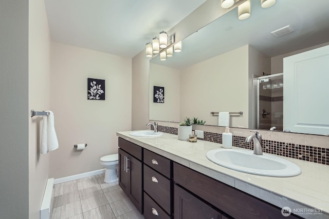 2546 NE Mulberry Walk, Issaquah, WA 98029 - bathroom featuring baseboards, visible vents, a stall shower, and a sink