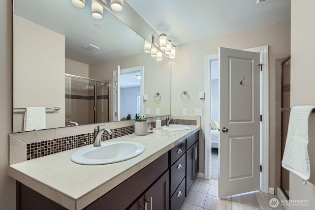 2546 NE Mulberry Walk, Issaquah, WA 98029 - full bathroom with tile patterned flooring, a sink, double vanity, and a stall shower