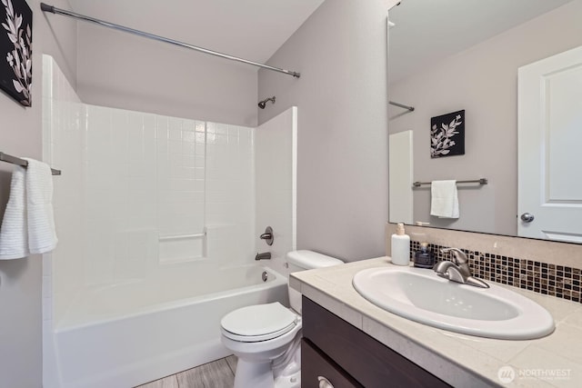 2546 NE Mulberry Walk, Issaquah, WA 98029 - bathroom with tasteful backsplash, toilet, wood finished floors, vanity, and tub / shower combination