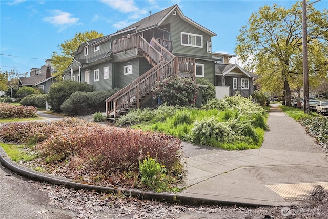 view of side of home with stairway
