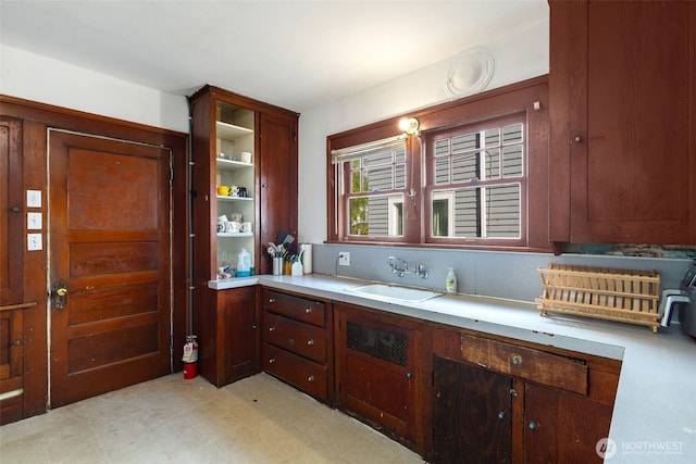 5019 17th Ave NE, Seattle, WA 98105 - kitchen featuring light countertops, a sink, and light floors