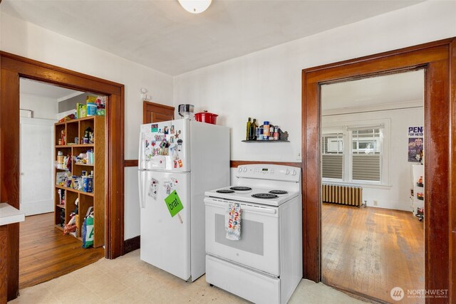 5019 17th Ave NE, Seattle, WA 98105 - kitchen with radiator heating unit, white appliances, and light floors