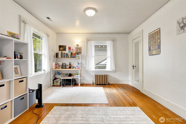 5019 17th Ave NE, Seattle, WA 98105 - interior space with radiator, wood finished floors, baseboards, and visible vents