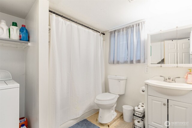 5019 17th Ave NE, Seattle, WA 98105 - bathroom with toilet, tile patterned floors, vanity, and washer / dryer