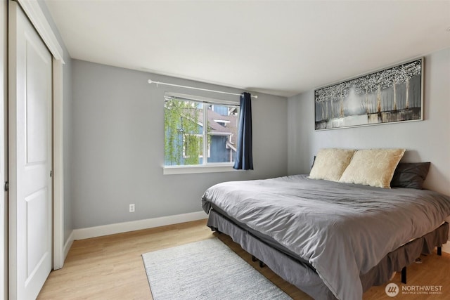 300 N 130th St Unit 8302, Seattle, WA 98133 - bedroom featuring wood finished floors, baseboards, and a closet