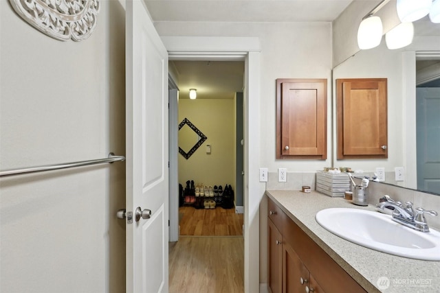300 N 130th St Unit 8302, Seattle, WA 98133 - bathroom featuring wood finished floors, vanity, and baseboards