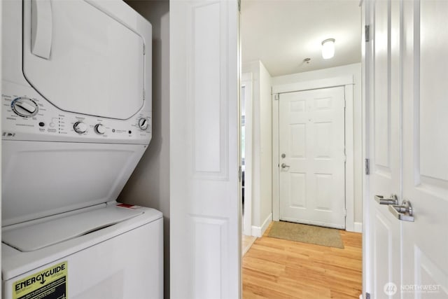 300 N 130th St Unit 8302, Seattle, WA 98133 - washroom featuring stacked washer and clothes dryer and light wood-style flooring