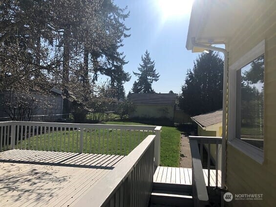 deck featuring a lawn
