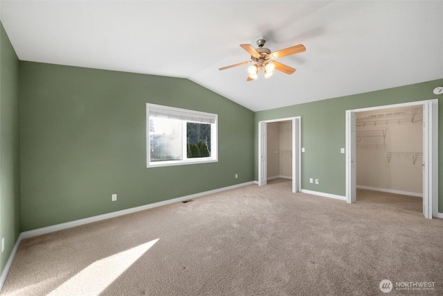 8148 Quinault Rd, Blaine, WA 98230 - unfurnished bedroom featuring lofted ceiling, baseboards, two closets, and carpet floors