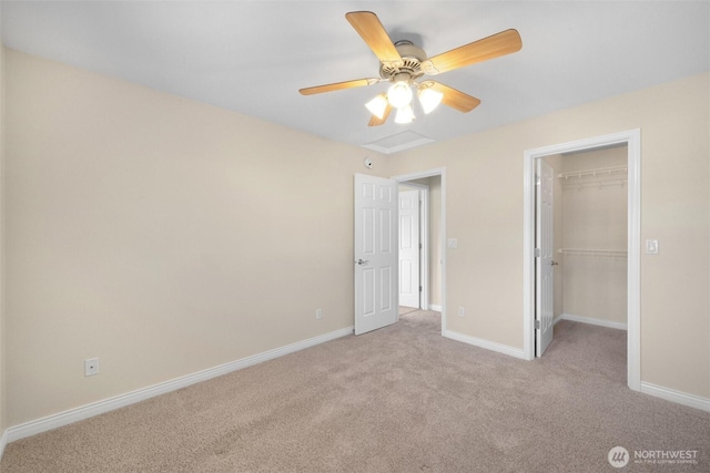 8148 Quinault Rd, Blaine, WA 98230 - unfurnished bedroom with a closet, baseboards, a spacious closet, ceiling fan, and light colored carpet