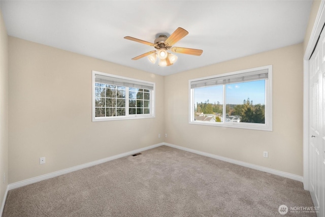 8148 Quinault Rd, Blaine, WA 98230 - carpeted empty room featuring baseboards and ceiling fan