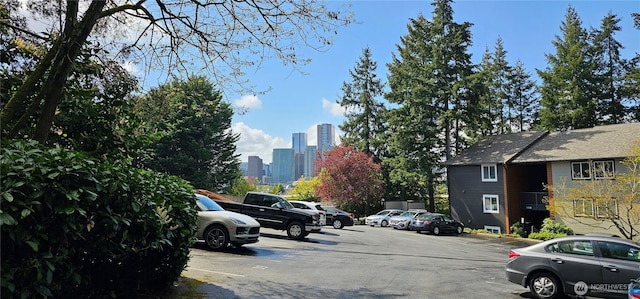 12219 NE Bel-Red Rd Unit D101, Bellevue, WA 98005 - uncovered parking lot with a skyline view