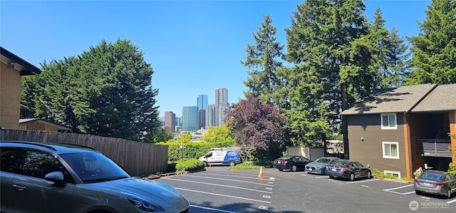 12219 NE Bel-Red Rd Unit D101, Bellevue, WA 98005 - uncovered parking lot featuring a skyline view
