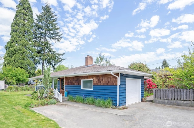 22332 10th Ave S, Des Moines, WA 98198 - view of front of home featuring a chimney and driveway