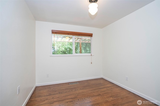 22332 10th Ave S, Des Moines, WA 98198 - unfurnished room featuring baseboards and wood finished floors
