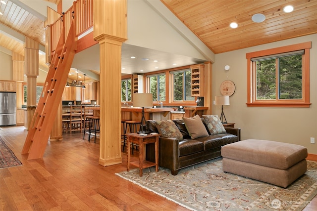 17650 Roaring Creek Rd, Leavenworth, WA 98826 - living room featuring recessed lighting, ornate columns, wood ceiling, and a healthy amount of sunlight
