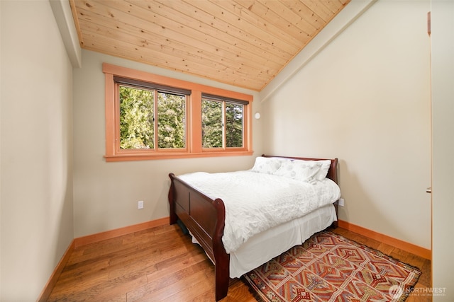 17650 Roaring Creek Rd, Leavenworth, WA 98826 - bedroom featuring wood ceiling, wood finished floors, baseboards, and lofted ceiling
